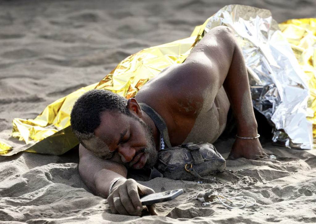 Exhausted migrants arrive on beach in Spain's Canaries